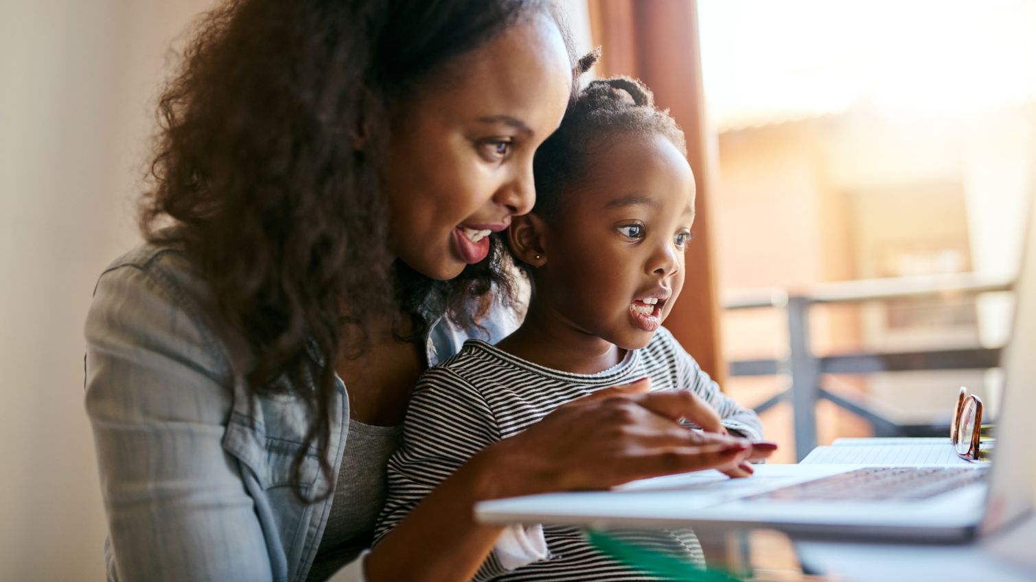 Mom and daughter fill out forms online